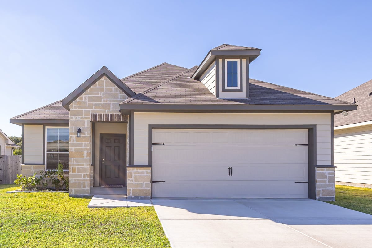 Traditional suburban single-family home with garage and garden, representing protecting a homeowner's equity