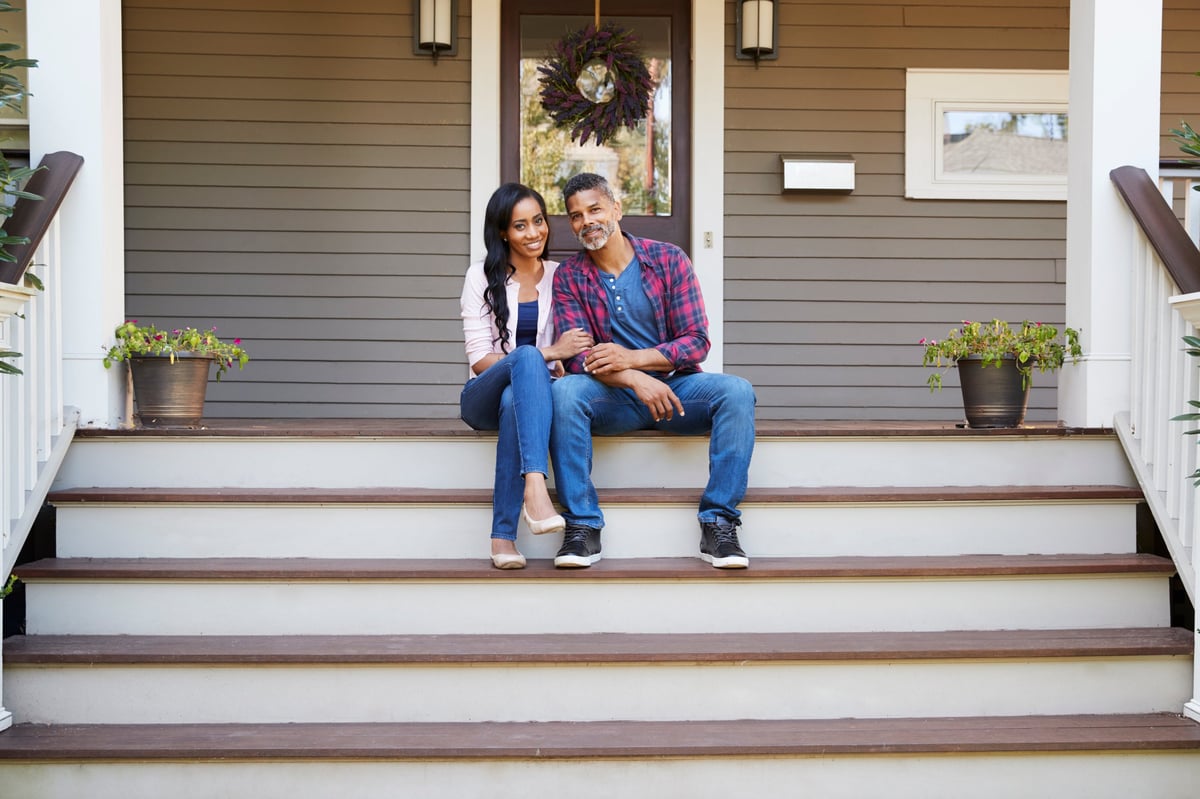 Michigan homeowners reviewing mortgage payoff information while planning their next move.